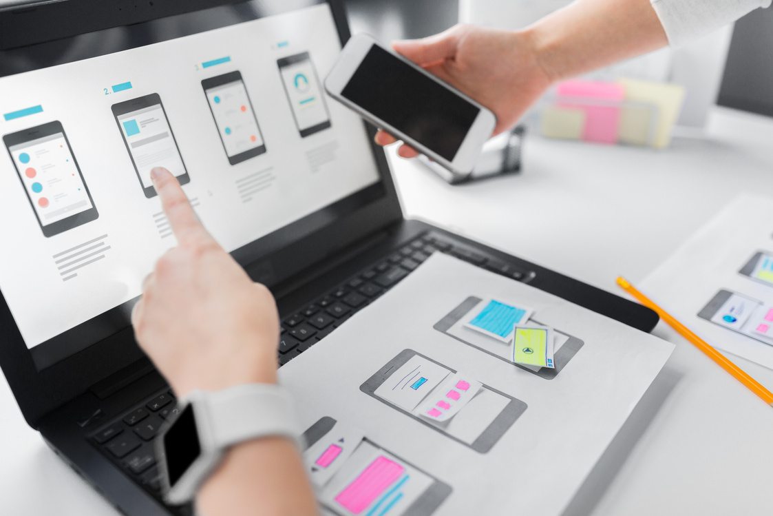 Web Designers Work on Smartphone User Interface